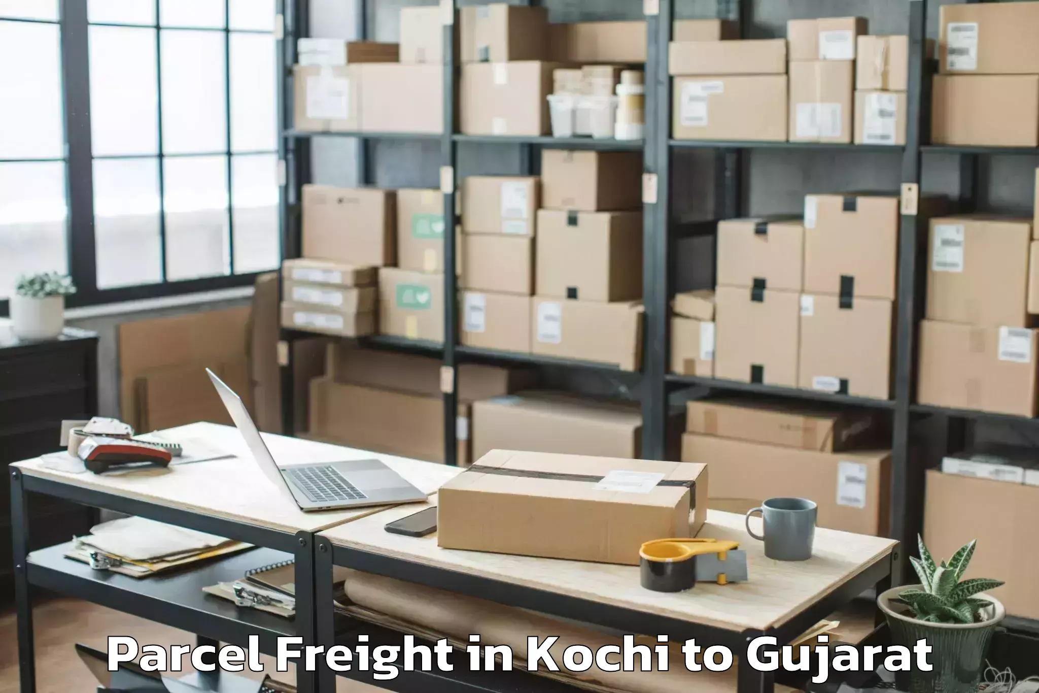 Book Your Kochi to Udhana Parcel Freight Today